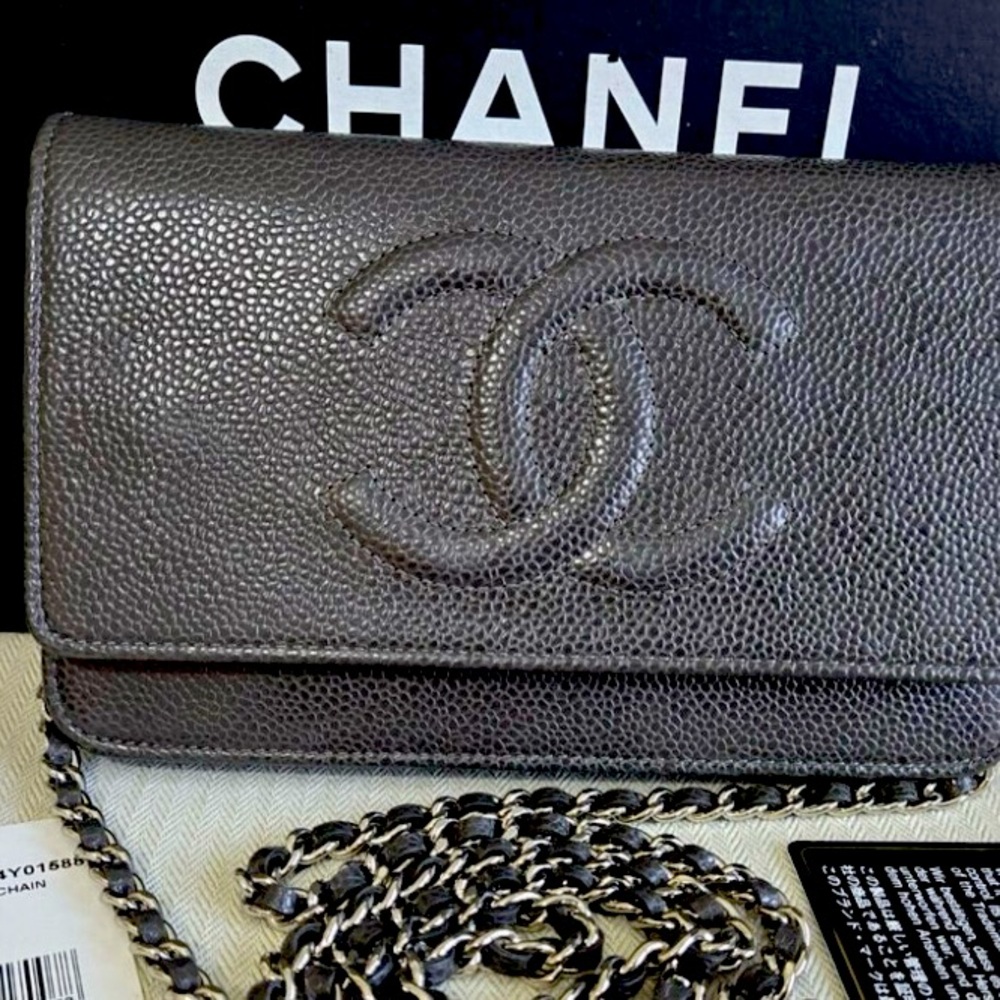 Black Chanel Caviar leather with silver hardware and burgundy lining.